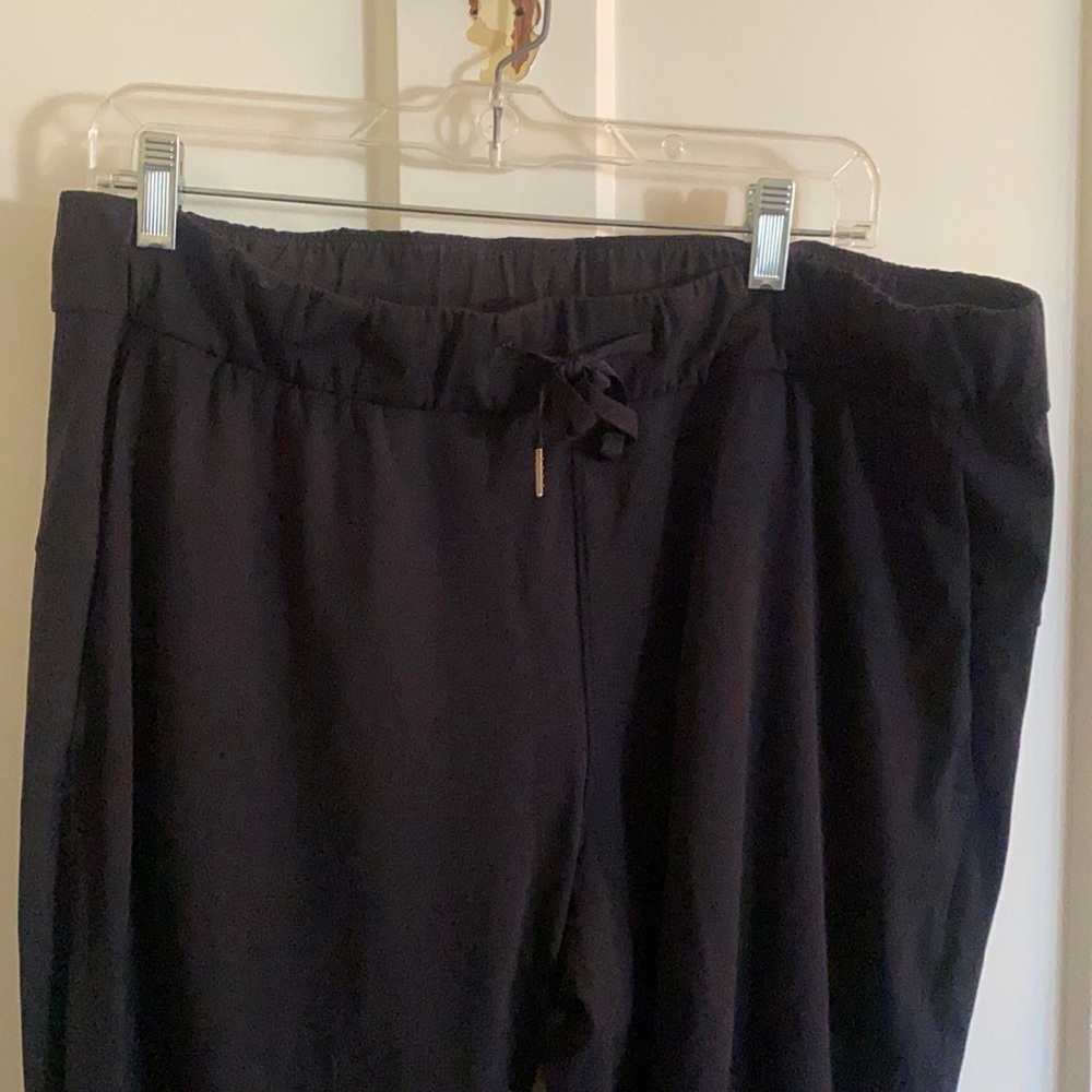 Black LULu Lemon travel pant, size 12. Drawstring waist with two front pockets.